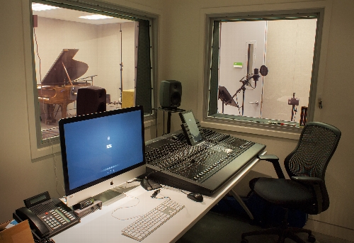 The view from the production control room. The main stage is seen through the left window; the voiceover booth is to the right.